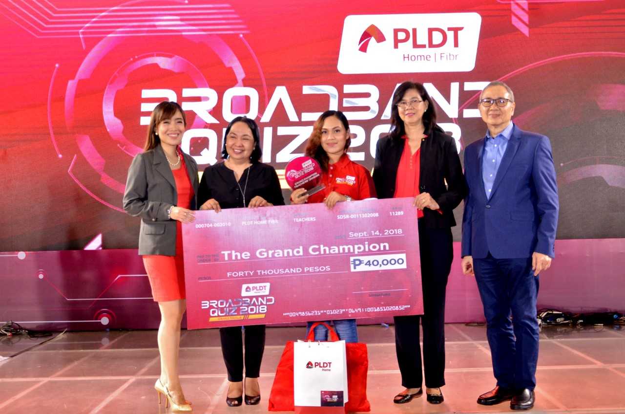 Rose Ann Prias, a 22-year-old Mathematics teacher from Ormoc, Leyte, center, is the Grand Champion of the recently-held PLDT Home Fibr Broadband Quiz, the culminating event of the Company’s long-running advocacy on digital literacy called the Infoteach Outreach Program. She is joined by, from left, PLDT Community Relations Division Head Katherine Diaz De Rivera, UP Open University Chancellor and Professor Melinda dela Peña Bandalaria, Department of Information and Communications Technology OIC Director for Finance Services Cheryl C. Ortega, and PLDT FVP and Head of Public Affairs Ramon Isberto.