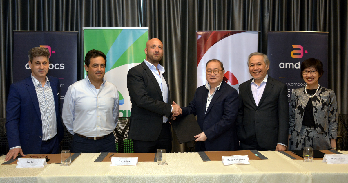 PLDT Chairman Manuel V Pangilinan, fourth from left, led the signing for the partnership with Amdocs officials. With him are Amdocs Regional Controller Aviv Sneh, Amdocs Limited General Manager Shai Levy, Amdocs Global Business APAC General Manager Dror Kalush, PLDT Chief Corporate Services Officer Ray Espinosa and Chief Financial Officer Anabelle Chua.