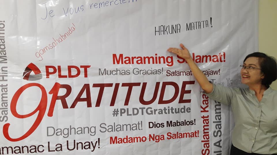 Consumer Experience Zone – Ilocos Executive Secretary Elvie Razo happily pose in the 91st Anniversary Gratitude Wall.