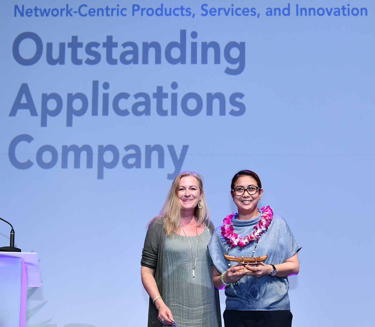 PLDT Global Corporation Vice President and Head for Carrier Business Edith Gomez accepts the award for Outstanding Applications Company