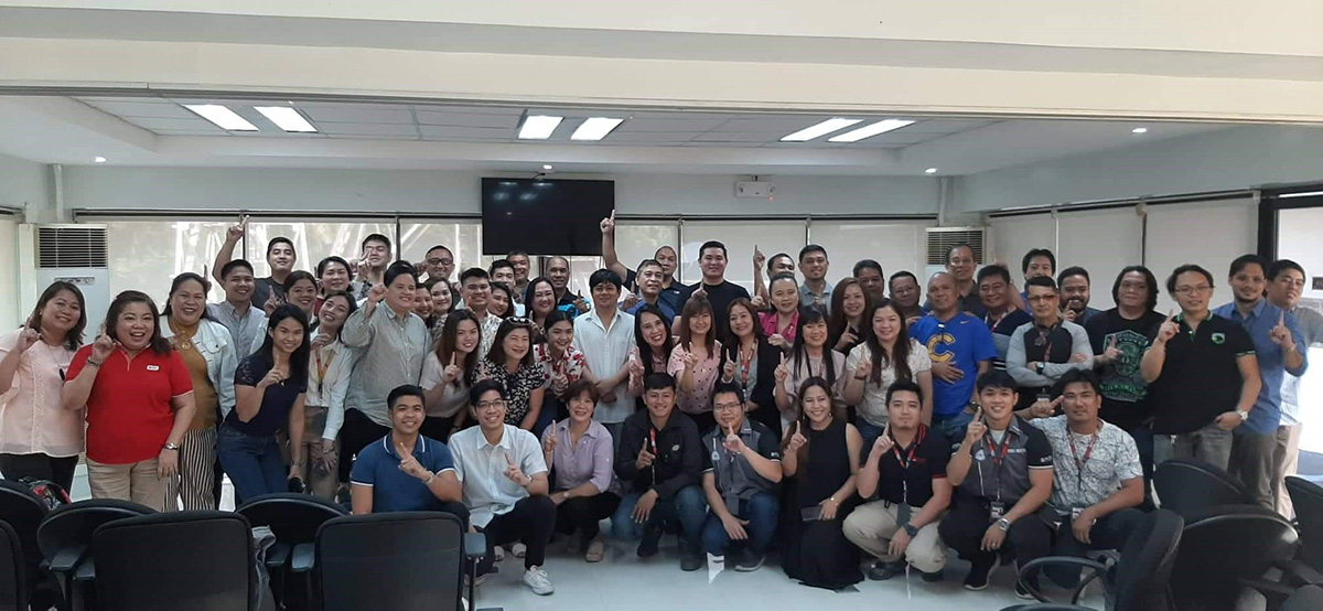 Employees pose for a group photo after the thanksgiving Mass at PLDT Bacolod.