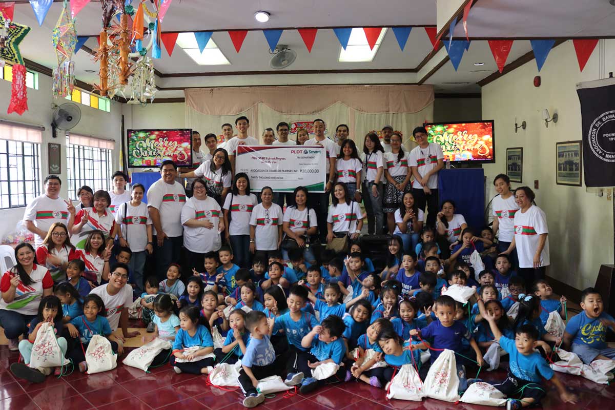 PLDT and Smart Tax Department with the PLDT-Smart Foundation team along with the students of Asociacion De Damas De Filipinas in Paco, Manila.