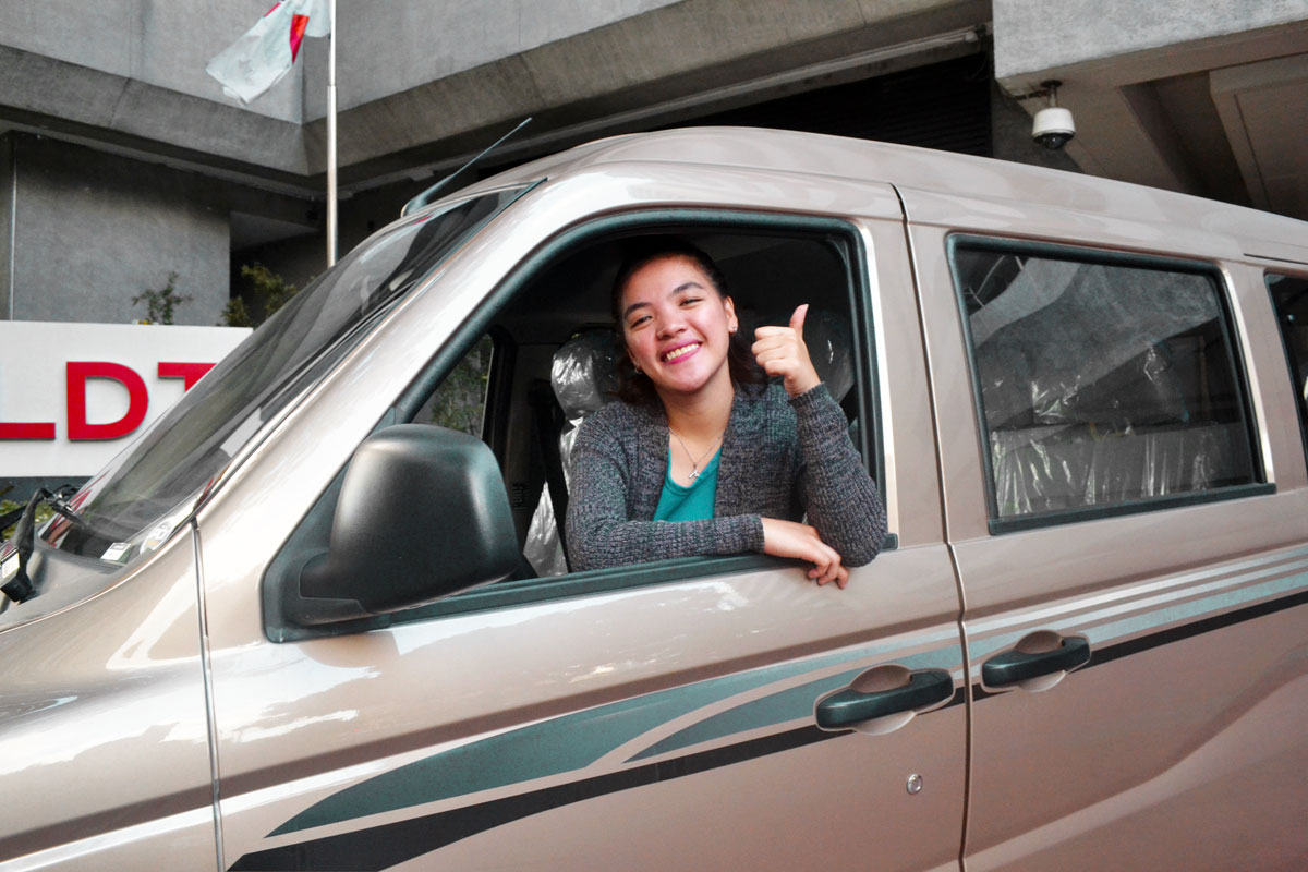 In photo is Mary Jean Libot inside her brand new 8-seater Foton Van.